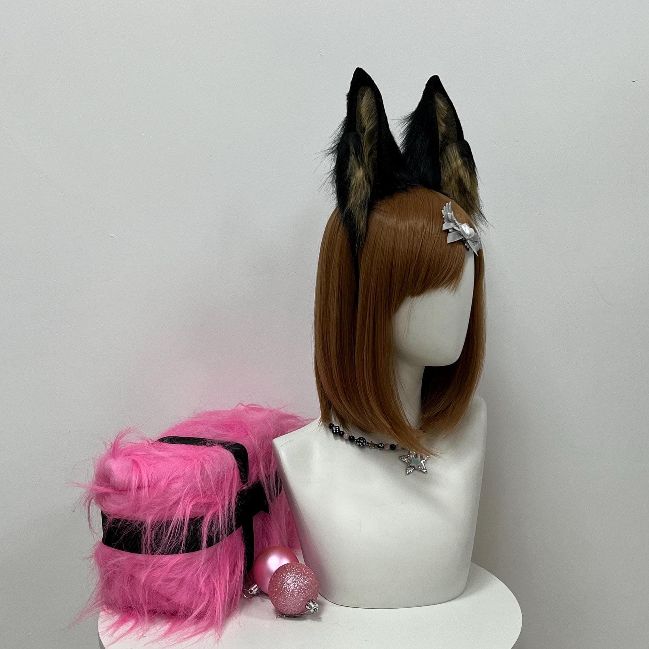 Side profile angle of the brindle brown and black wolf ears, revealing the layered brown marble pattern against solid raven outer fur and the way the pointed peaks lean forward. Ideal reference for cosplayers building a desert coyote, forest spirit, Egyptian jackal deity, ranger knight, or rugged warrior character. The hidden wire base lets wearers pose each ear independently forward or back for the perfect action shot pose at any convention photo meetup booth.