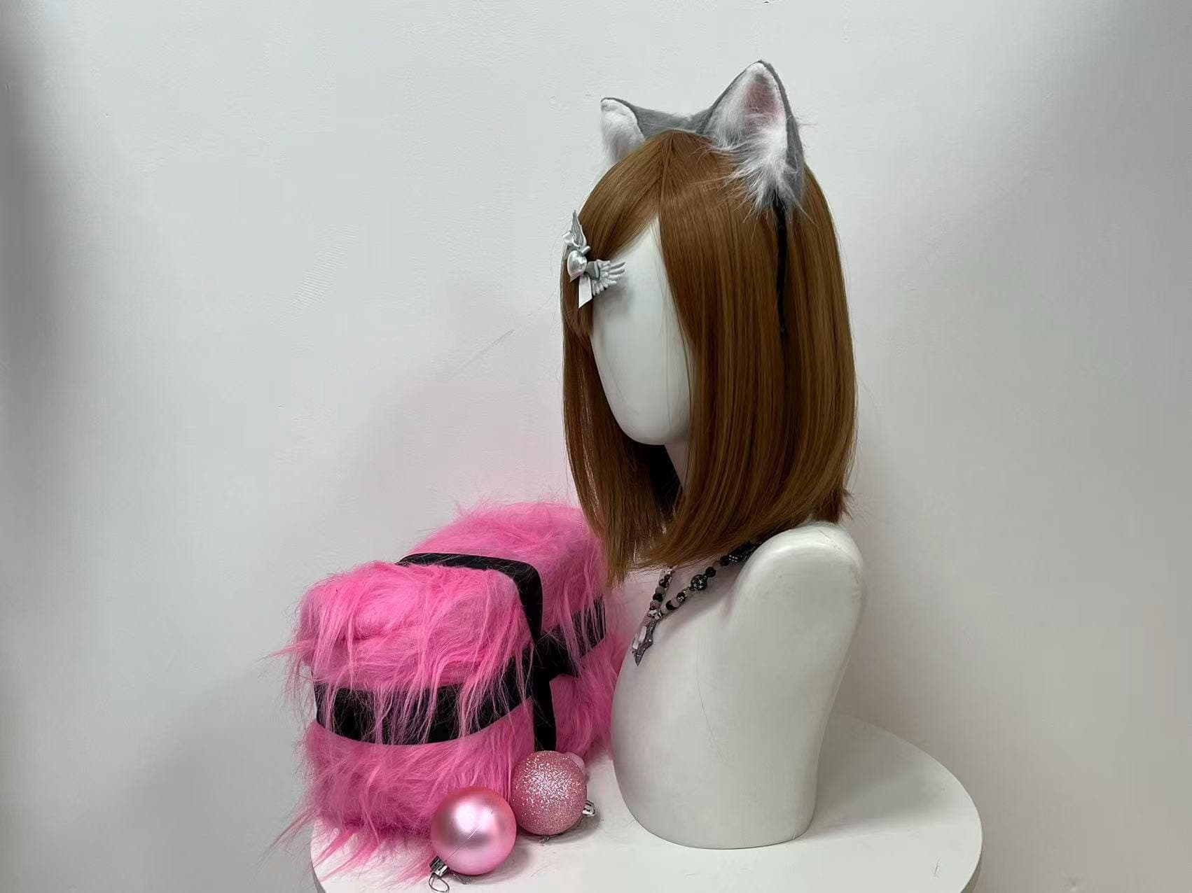 Side profile of the grey cat ears headband revealing the upright perky ear stance, a clean arc of the sturdy band hugging the crown shape, layered silver and snow white faux fur cascading softly along the back ridge, and a whisper of blush pink interior just visible at the angled tip. Ideal from every camera lens angle for con photo ops, furry therian gatherings, Halloween street looks, masquerade party nights, or dreamy profile feature shots across any cosplay feed.