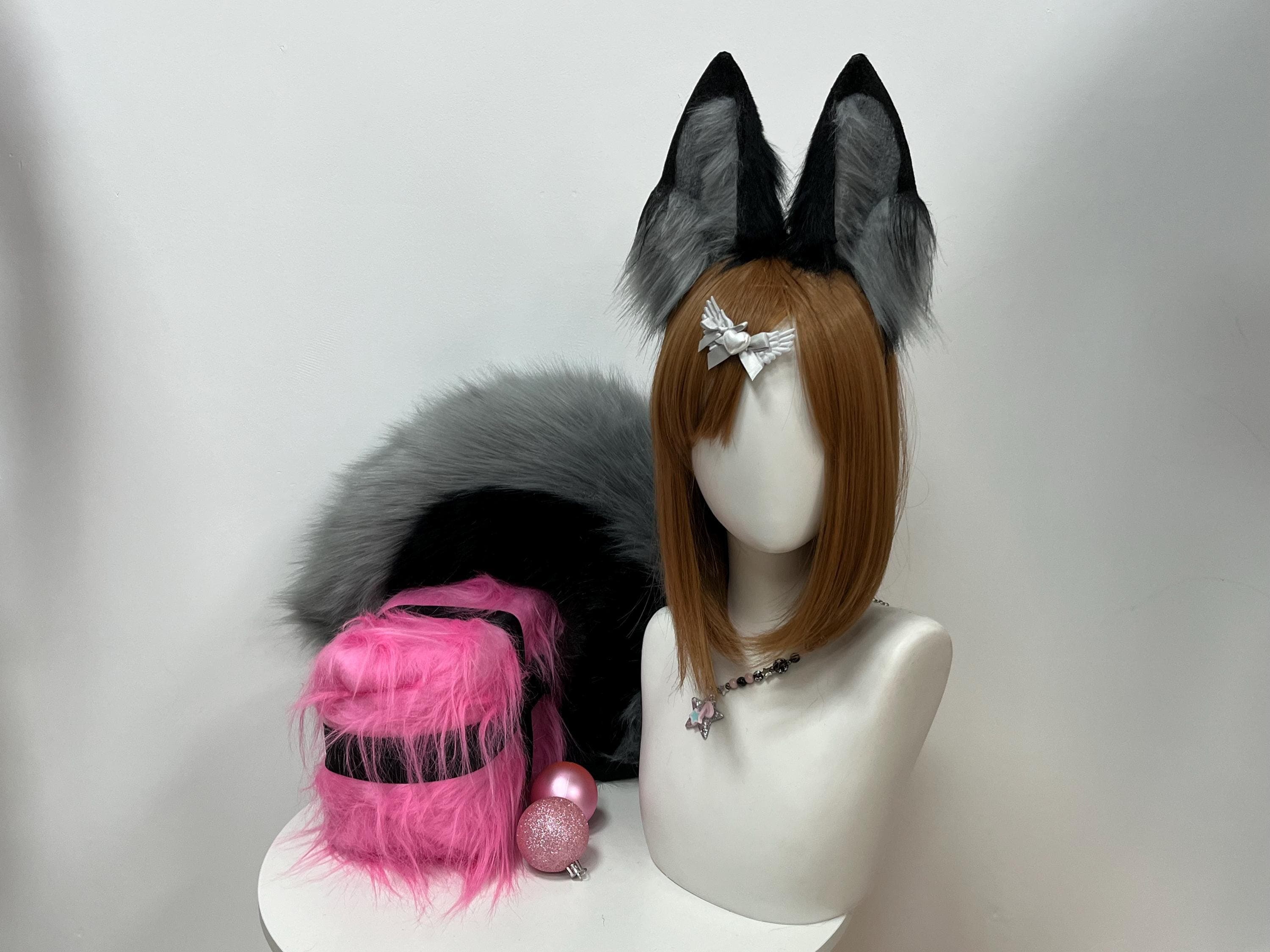 Clean front studio shot of the handcrafted grey and black fox ears and tail set showcasing the luxurious dense faux fur pile, ombre shading from dusky slate inner panels to jet charcoal tips, and the hand sewn crisp pointed ear silhouette. Lightweight wearable animal ears built for long con days, Halloween trick or treat nights, photoshoot sessions, gothic fantasy LARP, and kawaii streetwear. Matched with a thick bushy fox tail this set is a standout accessory for fox girl lovers.