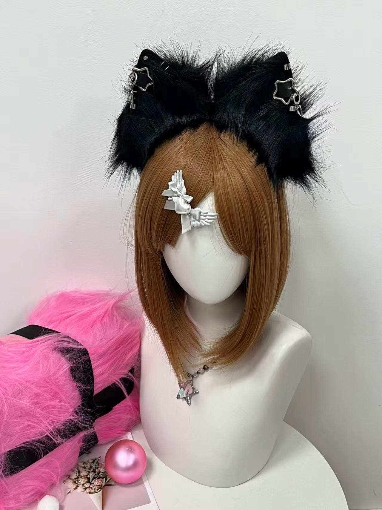 Handmade black faux fur fox ears headband shown front view, featuring fluffy rounded animal ear shape with dense jet black pile and signature silver chain star shaped piercings with spike charm drops on each ear. Perfect cosplay accessory for goth kemonomimi catgirl looks, punk anime outfits, Halloween vampire costumes, therian fursona builds, and dark alt fashion shoots. Lightweight comfy headband stays put all day and pairs beautifully with lolita or harajuku streetwear fits.