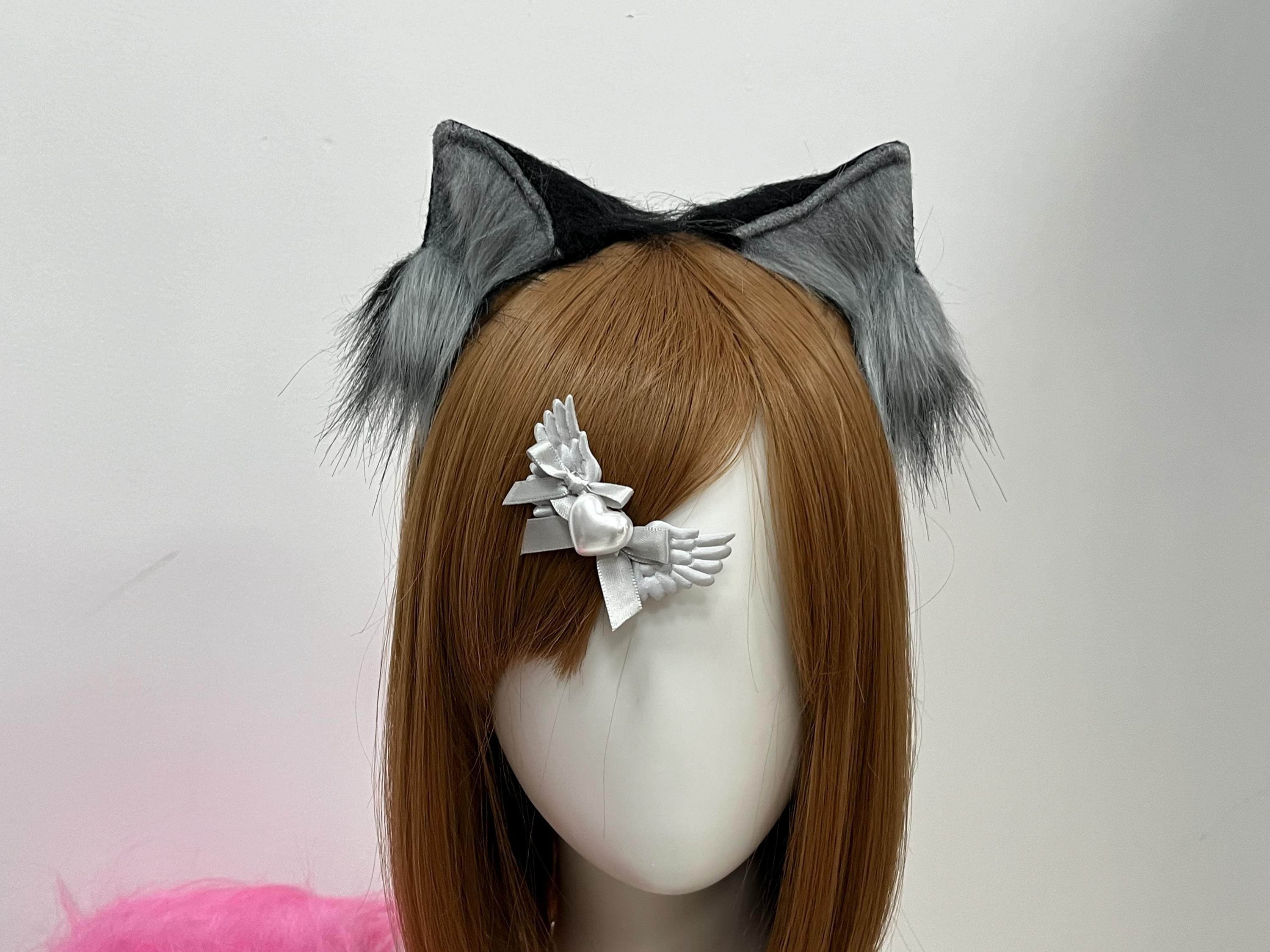 Up-close front crop of the realistic grey and black wolf ears, showing the hand-shaped lupine peaks and the smooth gradient where pale ash inside the cup deepens into midnight outer sides. The sturdy headband sits hidden beneath the auburn fringe, keeping the kemonomimi silhouette clean for detailed portrait work. Ideal grab for therian creators, furry fursuit partial builders, or anyone chasing a wild wolf pack vibe at an anime convention lineup.