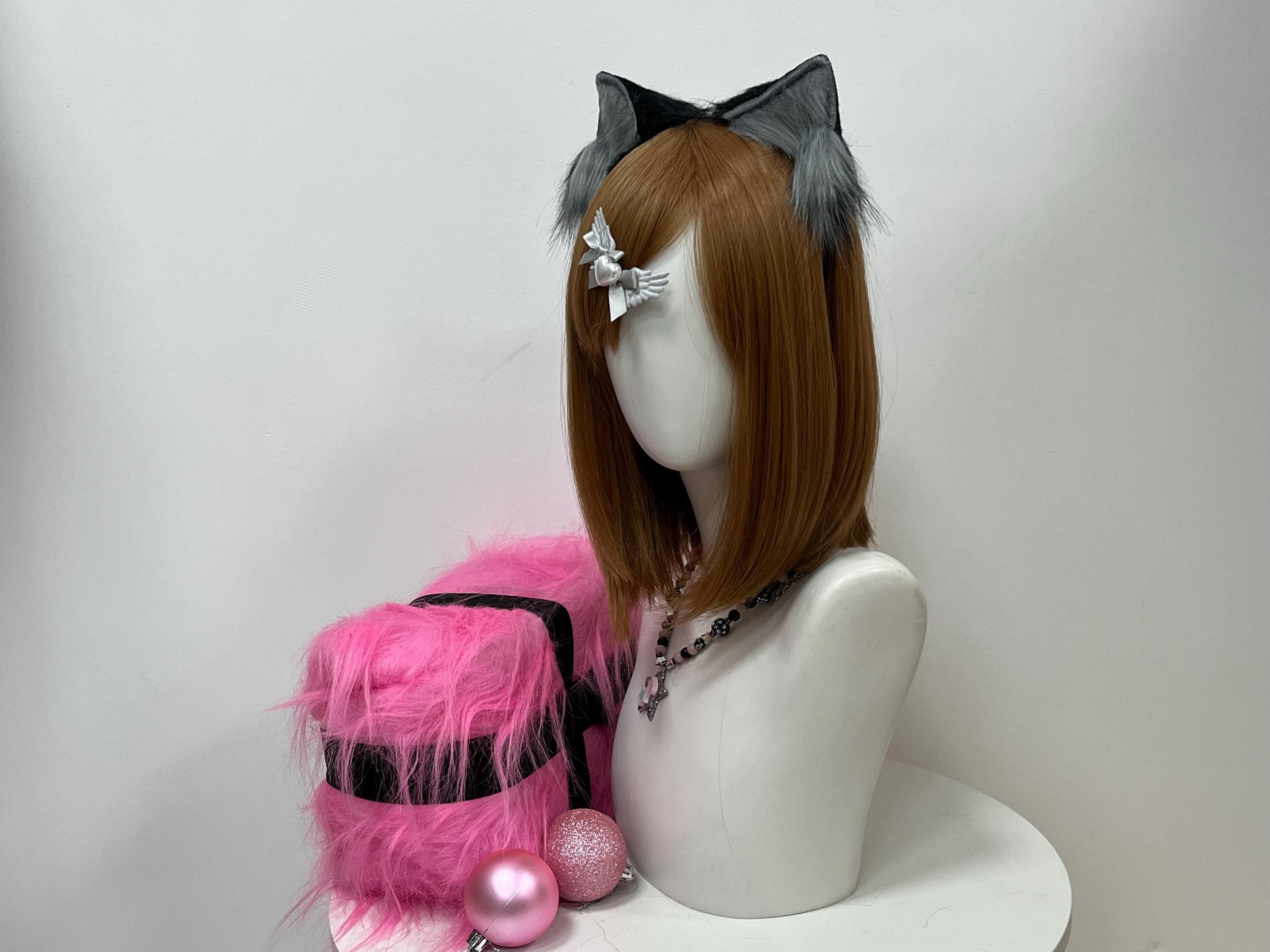 Side angle of the realistic grey and black wolf ears mounted on a chestnut bob, revealing the natural slant of each handmade peak and the way soft faux fur catches studio light along the curved outer edge. The silhouette holds its shape without flopping, giving werewolf LARPers and dire wolf role players a believable ear line which photographs crisp from any profile during a long festival day of questing and forest tavern storytelling sessions together.
