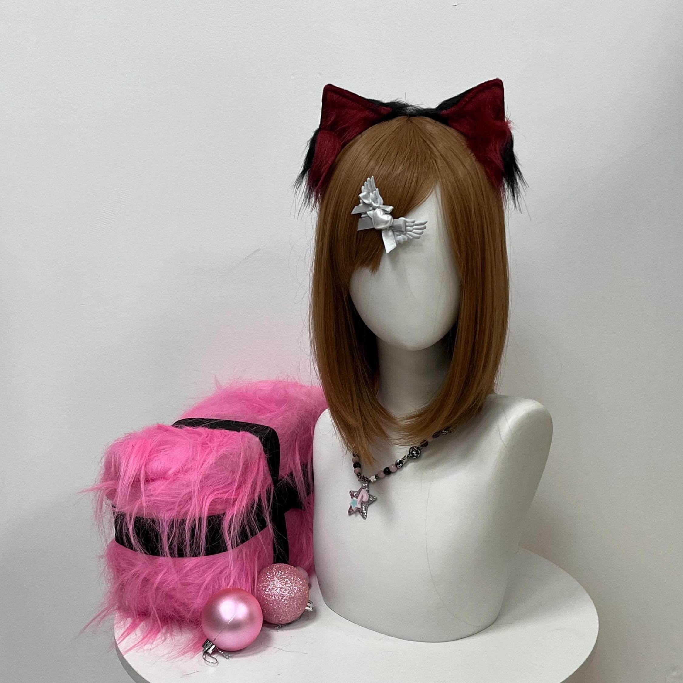 Realistic maroon and black wolf ears on a flexible headband, front hero shot revealing deep wine-red outer fur melting into jet black inner tufts. Handmade with brushed faux fur for a lived-in therian pelt vibe fursona builders crave. Slide them over your hair for instant feral wolf energy at anime cons, furry con meetups, LARP campaigns, or Halloween night festivities. The bicolor drama delivers wild predator attitude without weighing down your costume headpiece rig or kit.