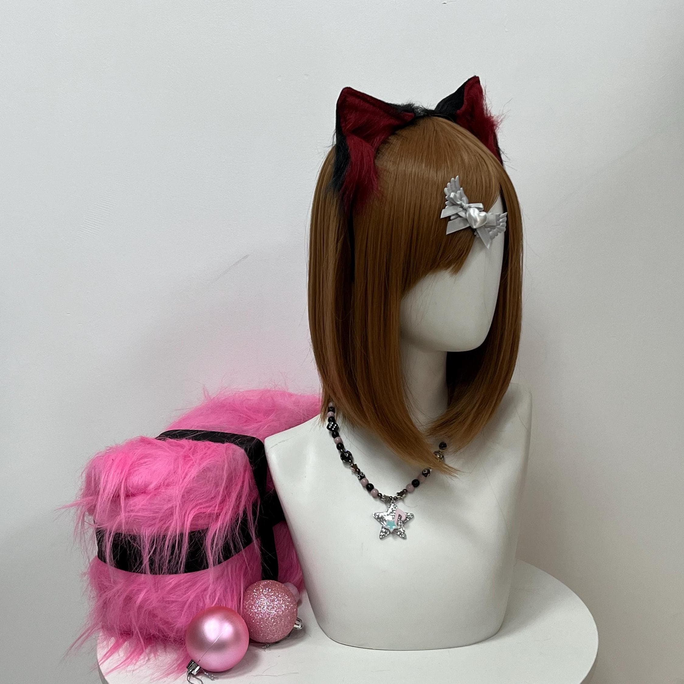 Angled three-quarter view of the maroon and black wolf ears headband, showing how the crimson front blends into inky outer shells. Soft faux fur catches ambient light for a cinematic feral glow reading from the front row. Perfect for therian wolfkin drops, kemonomimi streetwear styling, or cosplay con photoshoots. Pair with dark fantasy bard fits, rogue wolfborn OCs, or Halloween werewolf builds needing a killer finishing touch at anime expos or therian meets.