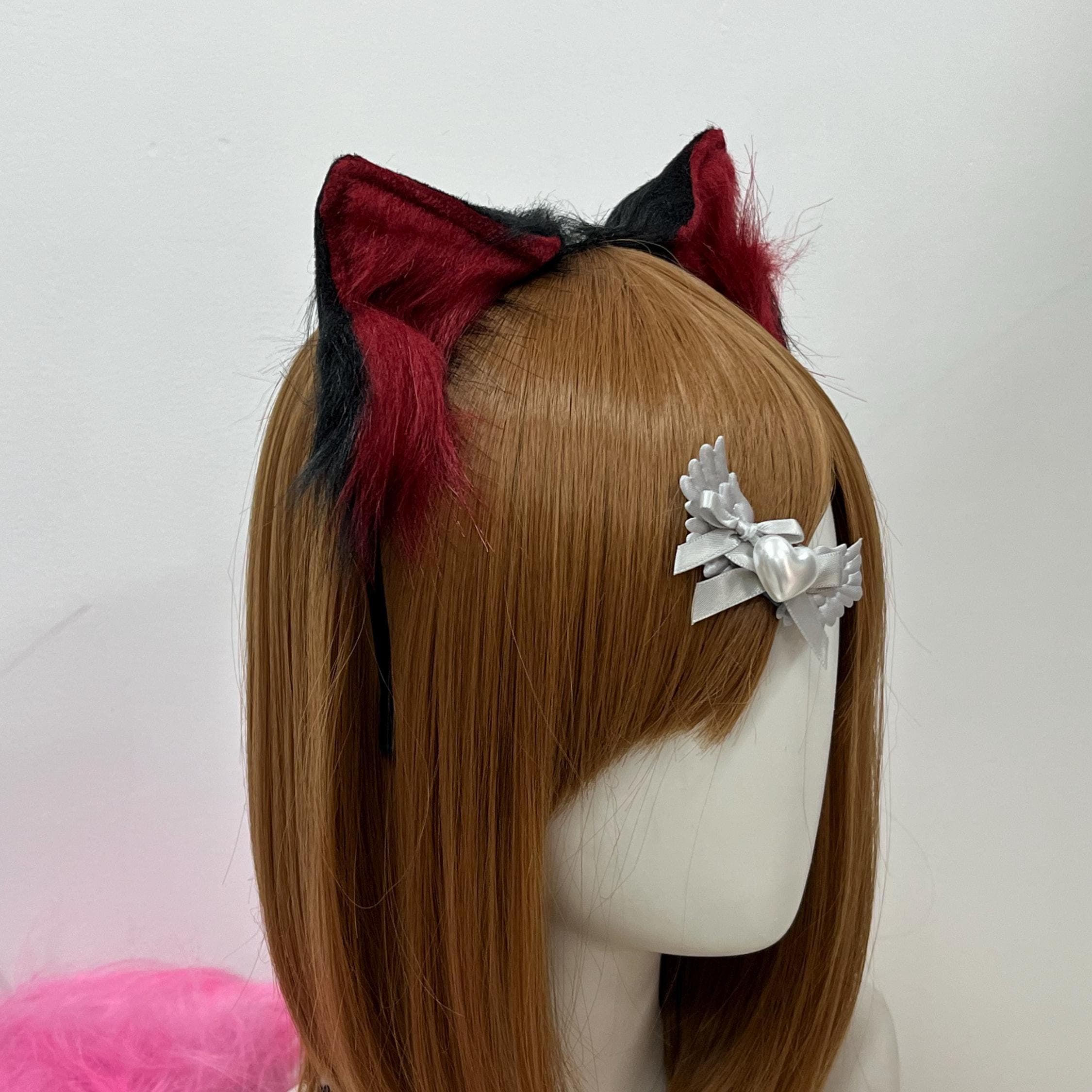 Detail close-up of the maroon and black wolf ears highlighting brushed faux fur gradient, realistic ear shape, and sturdy headband core. The crimson interior fur bleeds into midnight tips with subtle shading reading like authentic wolfkin pelt. Ideal for therian wear, fursona headpiece upgrades, cosplay wolf OCs, dark fantasy LARP bards, or Halloween werewolf transformations where texture and color depth make or break the final feral look on camera.