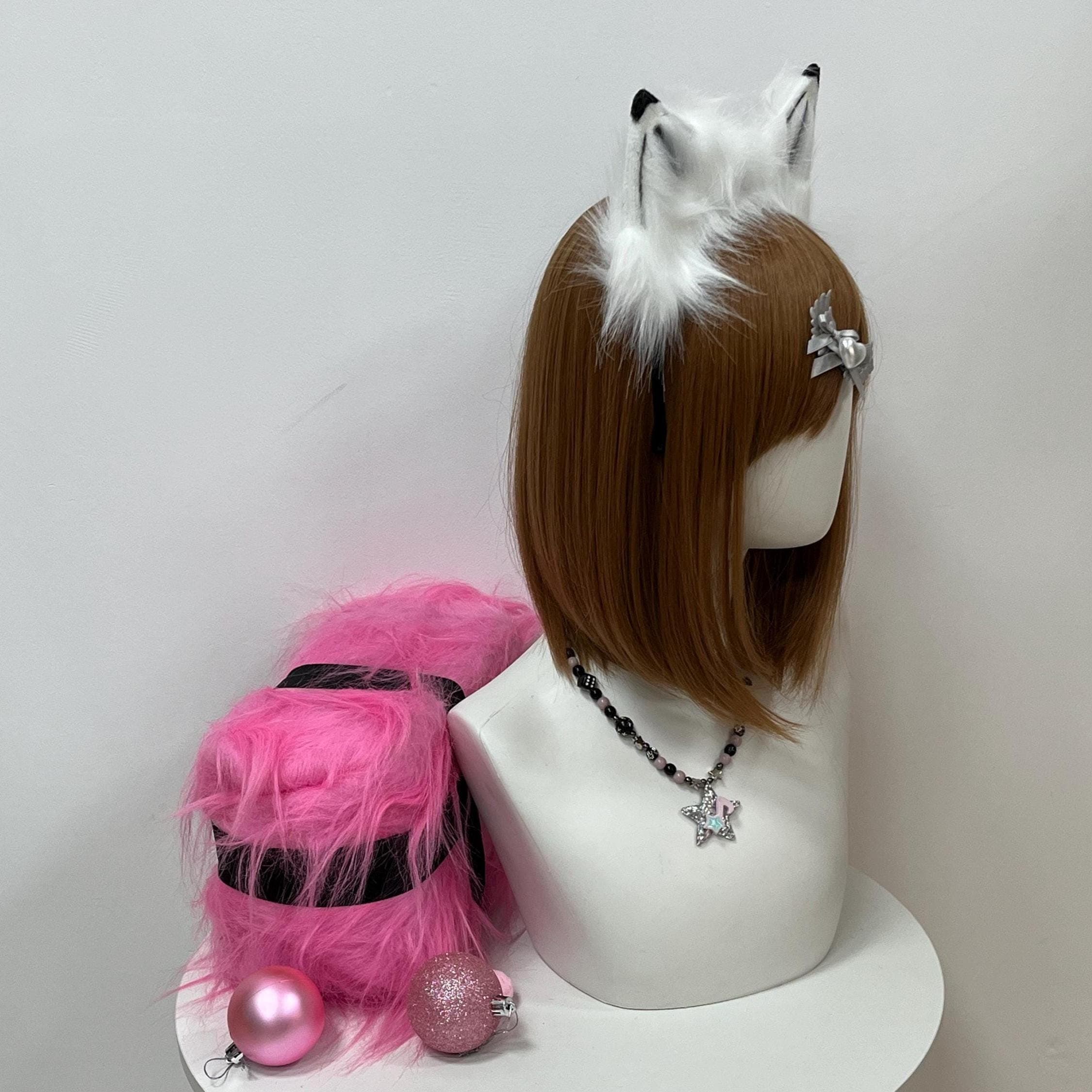 Opposite side angle of the black and white wolf ears shows the second pointed ear in matching detail, with shadowed interior shading and crisp dark tips catching festival lighting beautifully. The handmade headband balances symmetrically for furry fashion lovers, therian wear enthusiasts, and costume creators chasing a fierce striking lupine look. Pairs flawlessly with kemonomimi outfits, Halloween wolf costumes, and frosty winter convention sets.