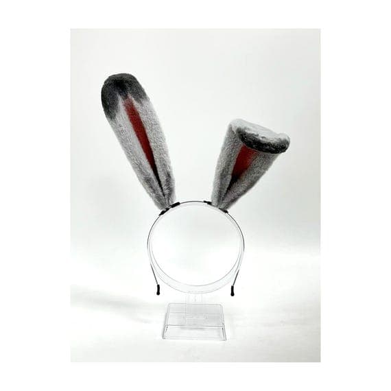 Grey rose bunny rabbit ears headband displayed on stand showing full product detail premium faux fur construction with poseable wire frame perfect for Easter Halloween cosplay. Professional product photo highlights soft grey outer fur dusty rose pink inner ear detail realistic rabbit ear shape proportions. Bendable ears allow custom positioning for different character builds anime cosplay convention outfits. Comfortable headband design lightweight all-day wear for rave festival costume party Eas