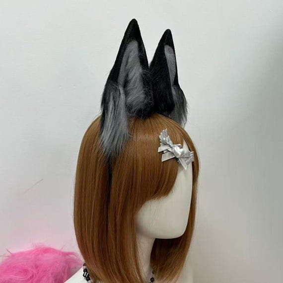 High-quality handmade wolf ears headband in vibrant orange and deep black faux fur, ideal for cosplay, fursuit light looks, Halloween costumes, and character roleplay. These custom wolf ears are attached to a black headband for secure fit and realism. Designed with cosplay photographers, performers, and furry community members in mind. A must-have cosplay accessory for those creating wolf-inspired characters.