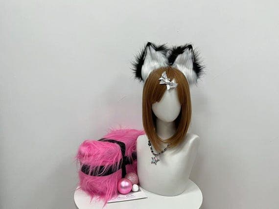 Black fox ears headband made from soft faux fur, perfect for cosplay and Halloween costumes. Comfortable and secure fit for furry character looks.