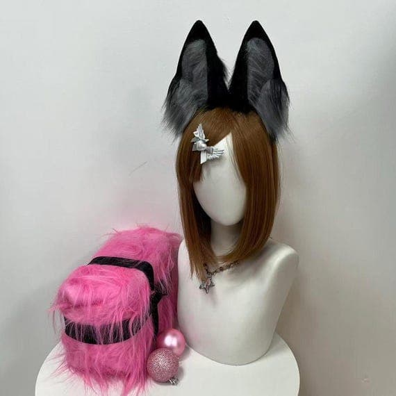 Wolf ears cosplay accessory in striking orange and black faux fur, handcrafted for costumes, Halloween looks, and furry character cosplay. These handmade ears sit securely on a headband, offering comfort and durability for events or photoshoots. A great gift for fans of handmade cosplay gear, realistic animal accessories, and custom costume design. Add these ears to your wolf costume or furry fashion outfit.