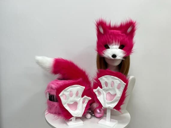 Complete set of soft, plush fox ears, paws, and tail for cosplay, furry costumes, and Halloween events. The ears are made of high-quality faux fur, offering comfort for long hours of wear. The paws feature realistic fur details and are ideal for animal-themed parties. The fluffy tail clips on easily for a seamless fox look. This set is perfect for cosplay conventions, costume parties, and playful fox-themed photoshoots