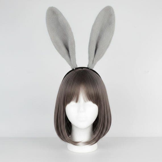 Classic plush rabbit ears headband in sophisticated neutral grey displayed on a mannequin head with styled wig. Extra tall 24cm dense fluffy faux fur bunny ears on a cushioned padded black headband weighing 65g. Full-size rabbit costume accessory featuring luxuriously thick plush texture ideal for Halloween costumes, cosplay events, anime conventions, Easter celebrations, themed party wear, creative photo shoots, and dress-up occasions. Also available in black, white-pink, and pink variations
