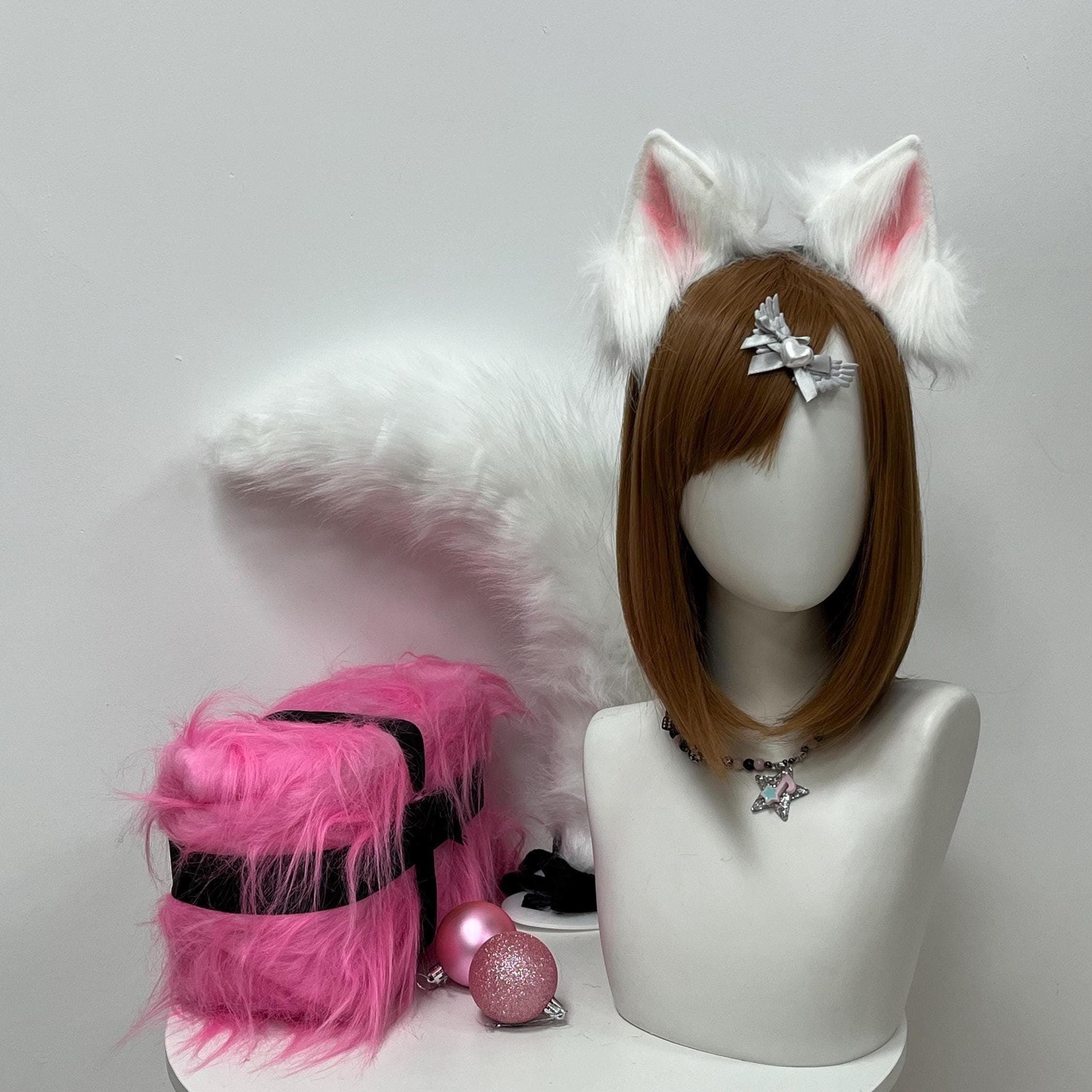 Snowy white faux fur fox ears headband paired with a matching cloud-soft tail, front view showcasing crisp ivory tufts spilling over a comfy padded band. Soft rosy inner ear lining peeks through plush pile for a sweet kemonomimi silhouette — a dreamy pick for arctic kitsune cosplay, anime con day wanders, frosted forest spirit fits, masquerade photoshoot evenings, magical girl roleplay sessions, or ethereal storybook costume lineups craving airy weightless fairytale detail.