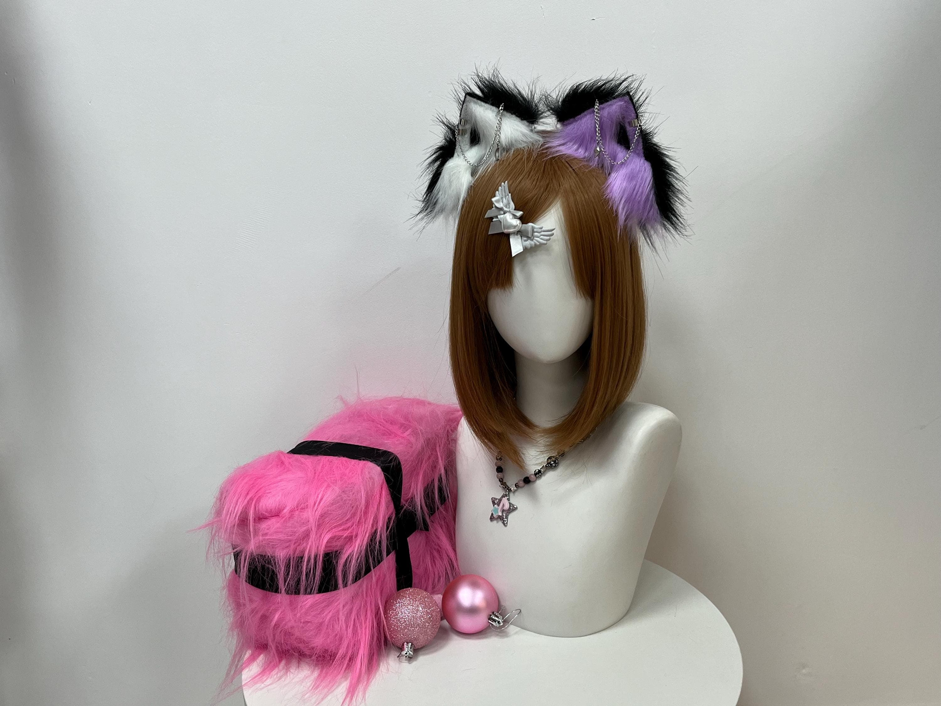 Mismatched realistic wolf ears headband pairs inky black outer fur with a crisp white inner panel on one side and lavender purple trimmed in black on the other, each ear strung with delicate silver chain detail. This asymmetric therian colorway lands clean for furry con hauls, kemonomimi OC fits, LARP character builds, or last-minute Halloween wolf costumes. Handmade faux fur stays soft and festival-ready all weekend long at any fandom meet or photo walk.
