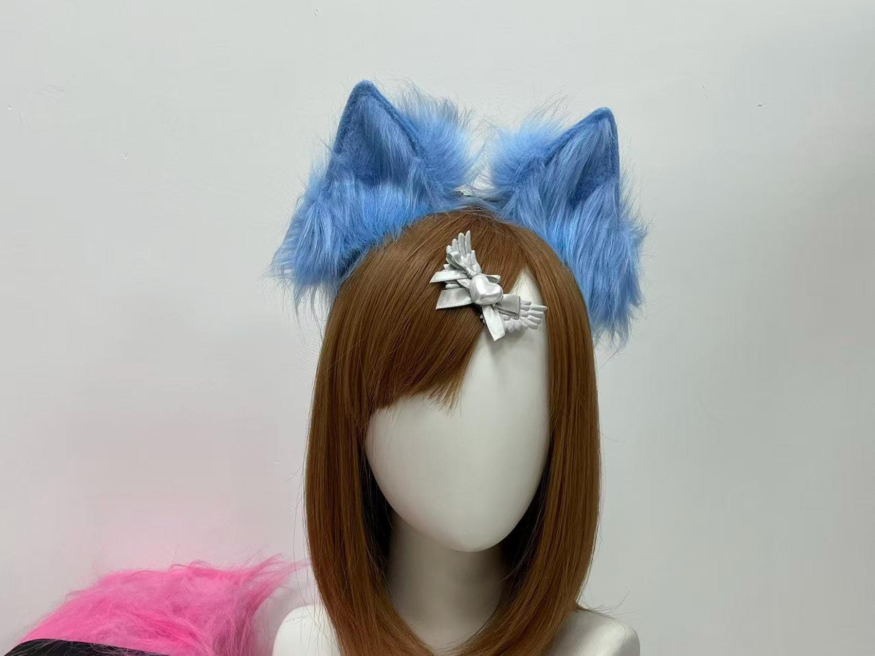 Sky blue faux fur wolf ear headband shown straight on, two tall pointed peaks crafted in soft icy cornflower pile, each tip hand shaped with a subtle inward curve for the alert lupine silhouette seasoned con goers chase. Plush faux fur catches studio light in cool cerulean and pale powder highlights, giving a frost wolf or arctic pup vibe ideal for anime convention builds, original fursona looks, fantasy ranger kits, winter queen fits and chilly outdoor photo shoots under grey cloudy skies.