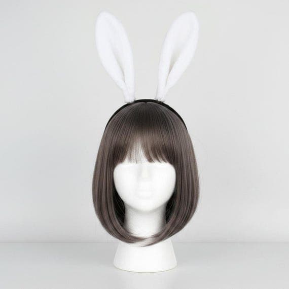 Pure white plush bunny ears headband displayed on a mannequin head with styled wig. Soft faux fur rabbit ears standing 18cm tall on a padded black headband providing secure and comfortable fit for hours. Lightweight 49g Easter bunny costume accessory ideal for spring celebrations, Halloween rabbit costumes, cosplay conventions, anime events, themed parties, dress-up play, and creative photo props. Available in five colors including pink, camel, grey, and black plush bunny ear headband styles